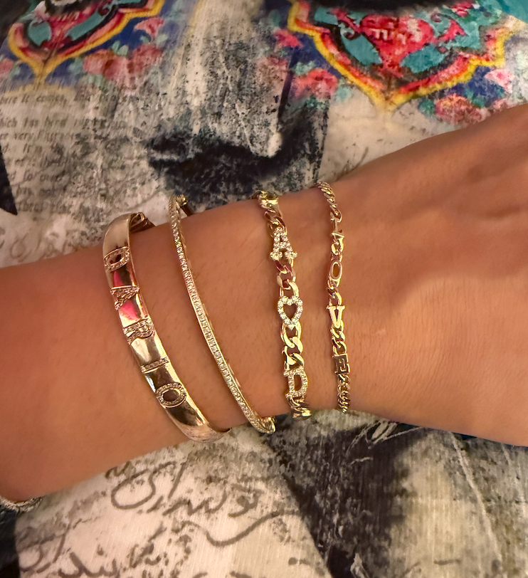 Large curb chain bracelet with diamond letters .