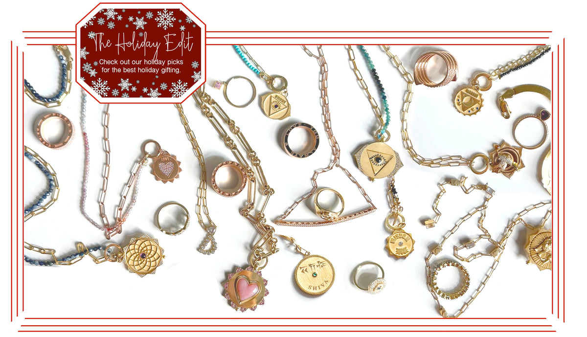 A curated collection of exquisite jewelry pieces for holiday gifting, featuring necklaces, rings, and charms.