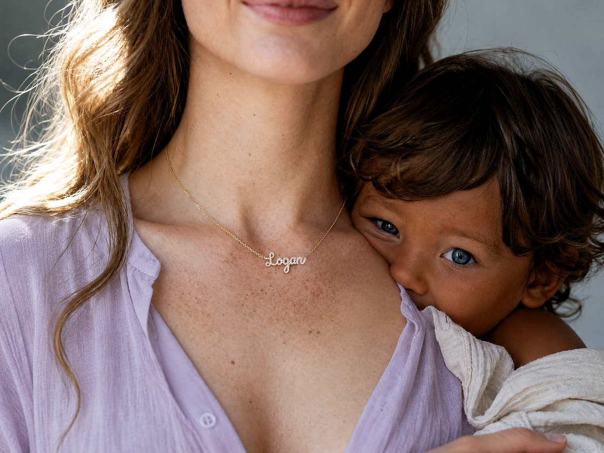Elegant layered necklaces with personalized name engravings "Sophie" and "Dan" showcased on a model's neckline.